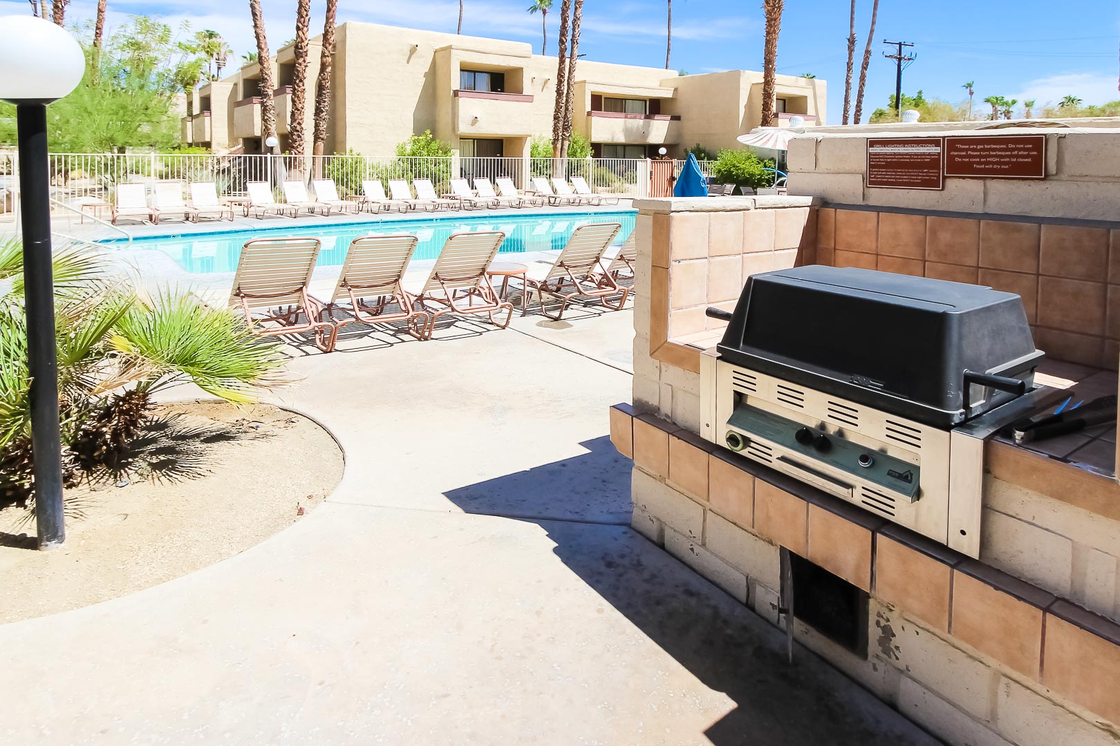 BBQ Grills next to the outdoor swimming pool at VRI's Desert Vacation Villas in Palm Springs California.
